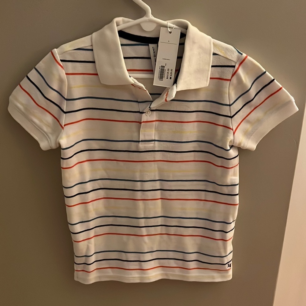 Never worn boys size 5 multicolored polo shirt.